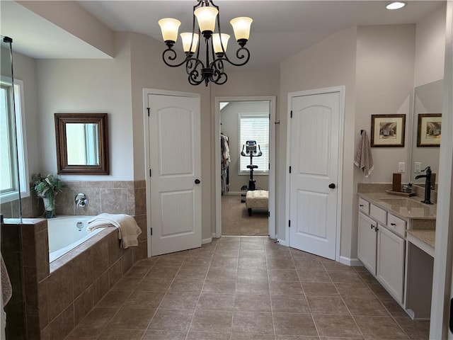 4745 Belcrest Way, Cumming, GA 30040 - bathroom featuring vanity, a garden tub, a chandelier, and tile patterned floors