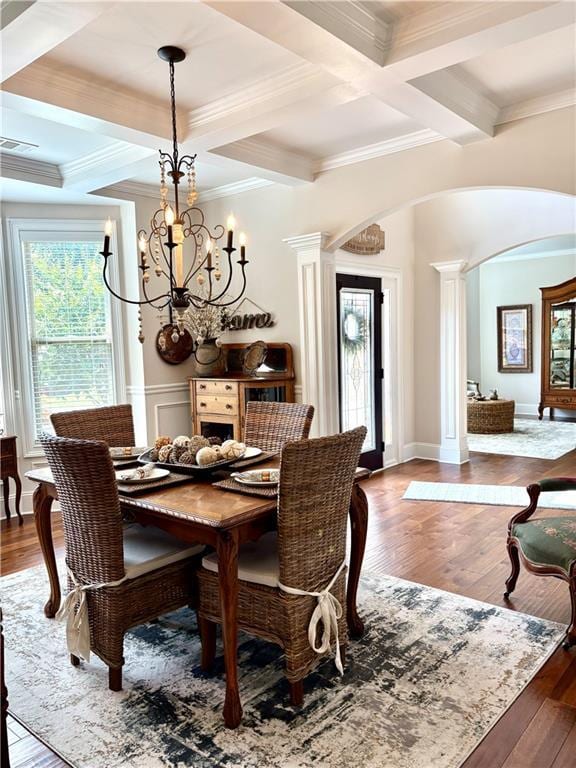 4745 Belcrest Way, Cumming, GA 30040 - dining room with arched walkways, healthy amount of natural light, coffered ceiling, ornamental molding, and beam ceiling