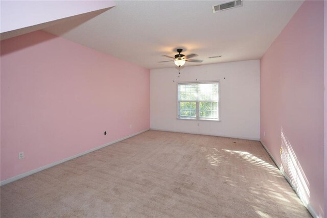 carpeted empty room featuring ceiling fan