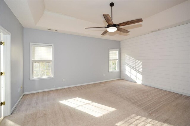 carpeted empty room with ceiling fan