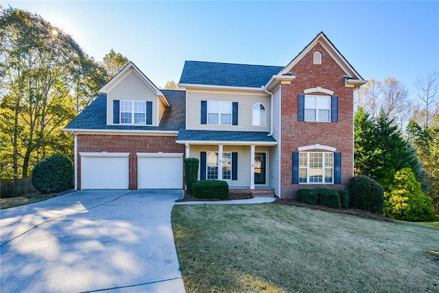 front facade with a front yard and a garage