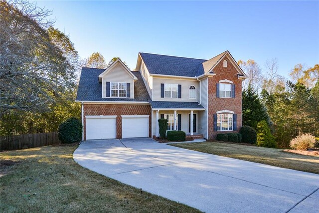 view of front property with a front yard and a garage