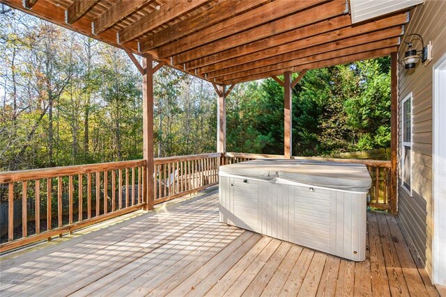 deck featuring a hot tub