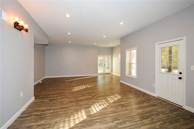 interior space featuring plenty of natural light and dark wood-type flooring