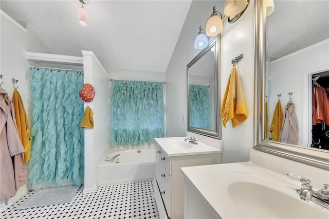 bathroom with crown molding, a washtub, vanity, and vaulted ceiling