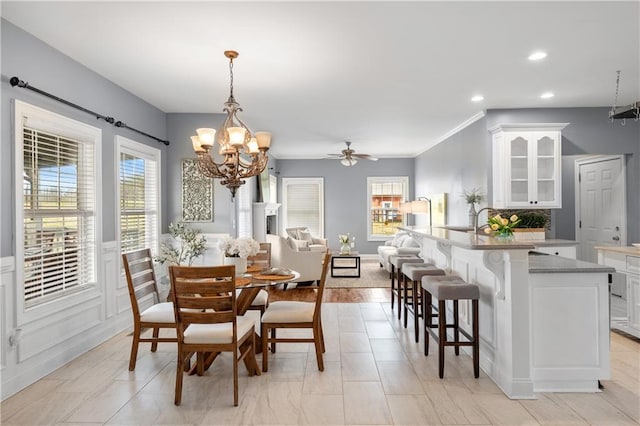 dining room featuring recessed lighting and ceiling fan with notable chandelier