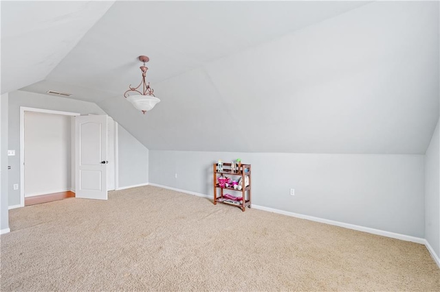 bonus room featuring visible vents, baseboards, lofted ceiling, and carpet floors