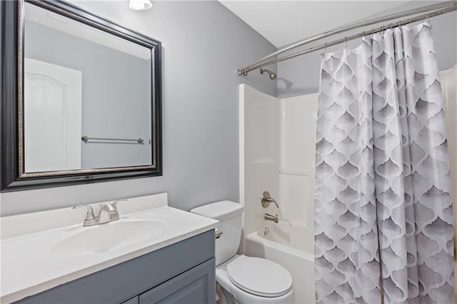 full bathroom featuring shower / bath combination with curtain, toilet, and vanity