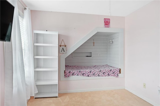 carpeted bedroom with baseboards