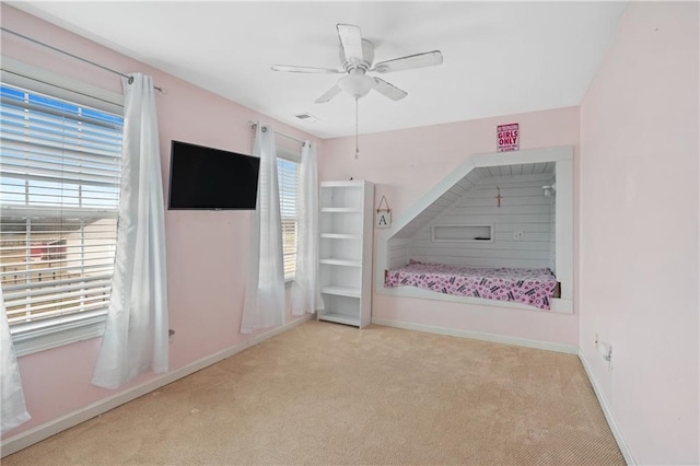 unfurnished bedroom featuring baseboards, visible vents, and carpet floors