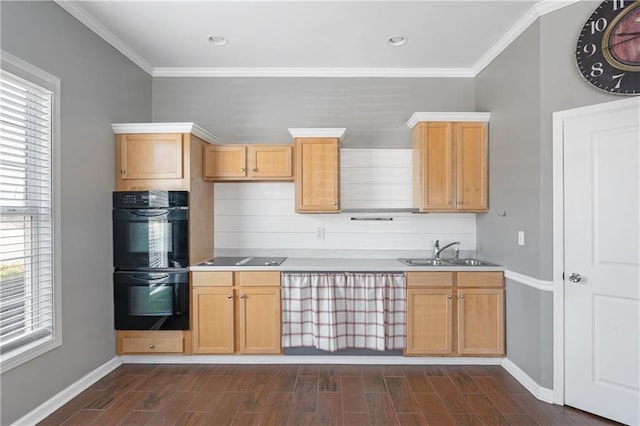 kitchen featuring a sink, dark wood-type flooring, black appliances, and crown molding