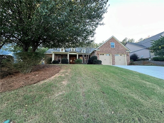 view of front of home featuring a front yard and a garage