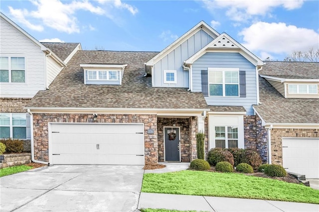 view of front of property with a garage and a front yard