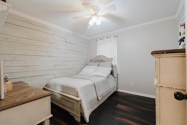 bedroom with ornamental molding, dark wood finished floors, wooden walls, and baseboards