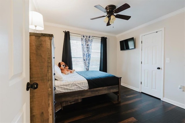 bedroom featuring ceiling fan, crown molding, baseboards, and wood finished floors