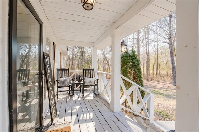 wooden terrace featuring a porch