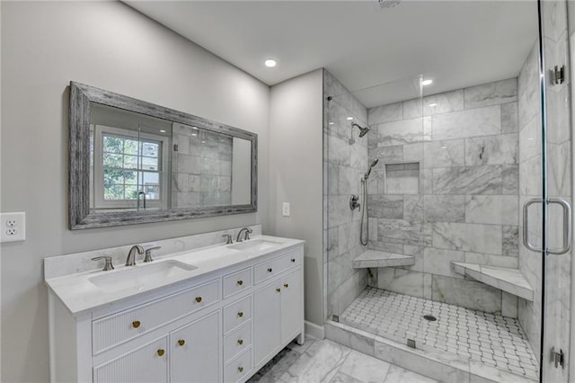 bathroom with vanity and an enclosed shower