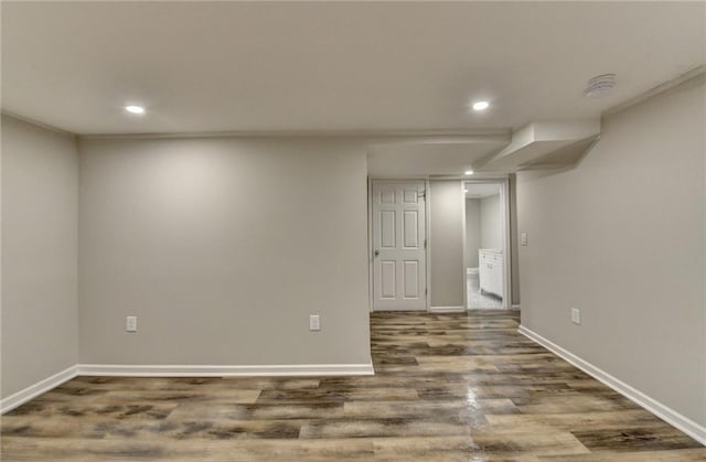 basement featuring dark hardwood / wood-style flooring