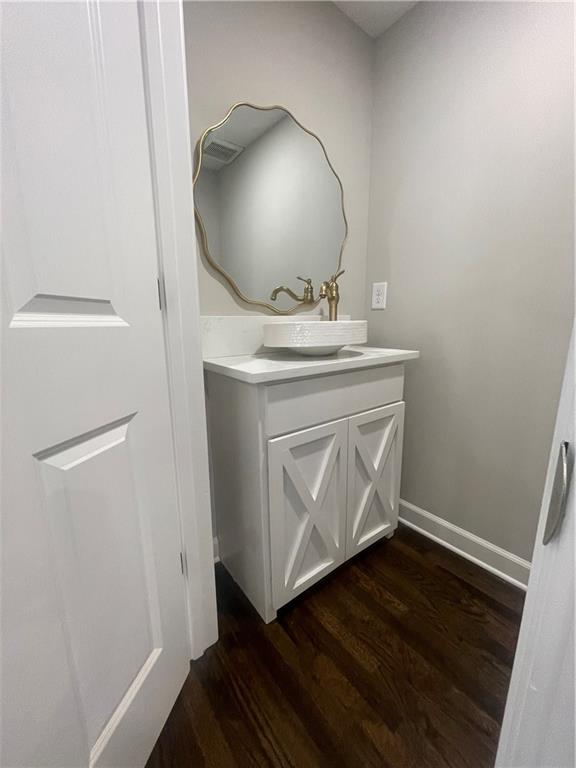 bathroom featuring hardwood / wood-style floors and vanity