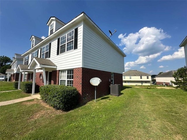 630 Mill Stone Blf Unit B, Monroe, GA 30655 - view of side of home with brick siding and a lawn