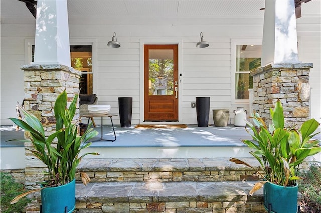 doorway to property featuring covered porch