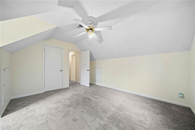 additional living space with lofted ceiling, carpet flooring, visible vents, and baseboards