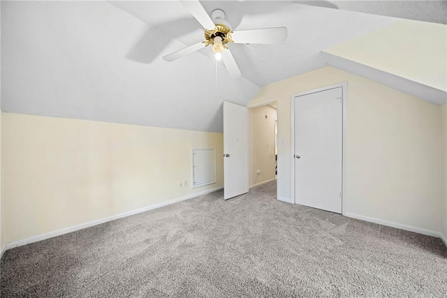 bonus room featuring carpet floors, lofted ceiling, ceiling fan, and baseboards