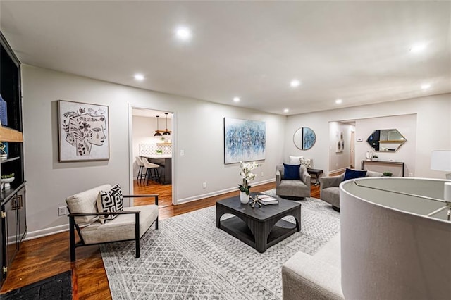 living room with baseboards, dark wood-style flooring, and recessed lighting