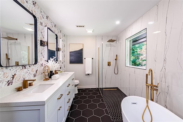 full bath with visible vents, a sink, a marble finish shower, and double vanity