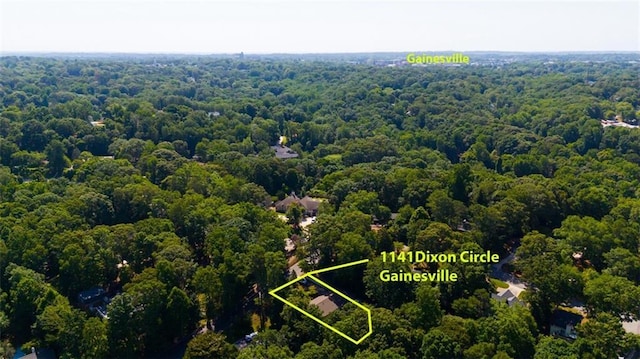 aerial view featuring a view of trees