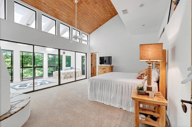 carpeted bedroom featuring wooden ceiling, high vaulted ceiling, and access to exterior