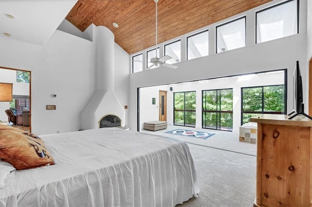 bedroom with high vaulted ceiling, carpet flooring, ceiling fan, and wooden ceiling