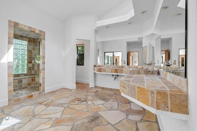 bathroom featuring shower with separate bathtub