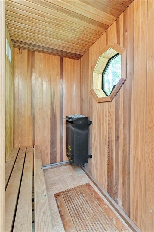 view of sauna / steam room with wood walls and wood ceiling