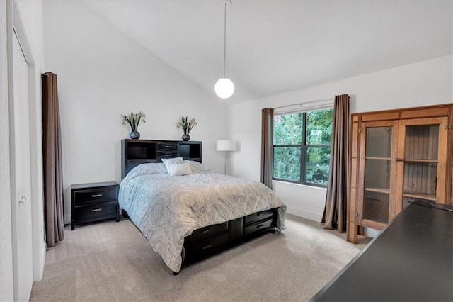 bedroom featuring carpet flooring and vaulted ceiling