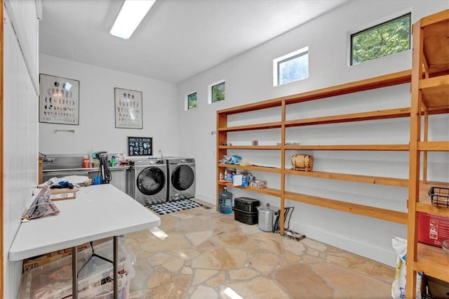 clothes washing area with washing machine and clothes dryer