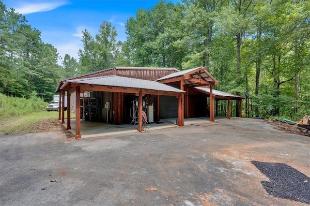 exterior space with a carport