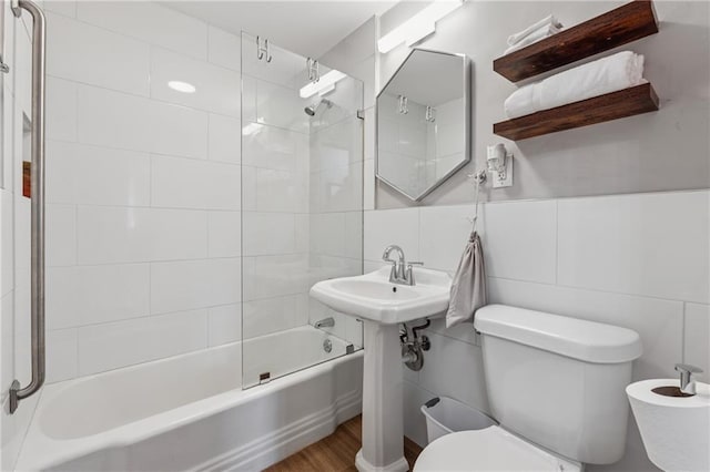 215 Piedmont Ave NE Unit 506, Atlanta, GA 30308 - full bathroom with toilet, wood finished floors, shower / bathtub combination, and tile walls
