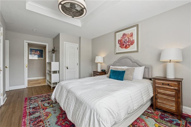 215 Piedmont Ave NE Unit 506, Atlanta, GA 30308 - bedroom with crown molding, baseboards, a raised ceiling, and wood finished floors