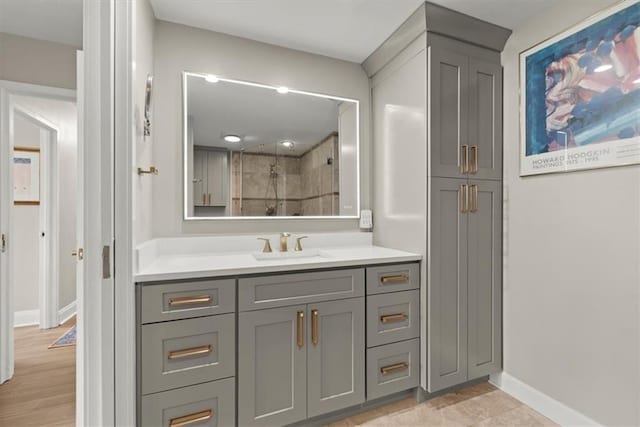 215 Piedmont Ave NE Unit 506, Atlanta, GA 30308 - bathroom with baseboards, a shower stall, and vanity