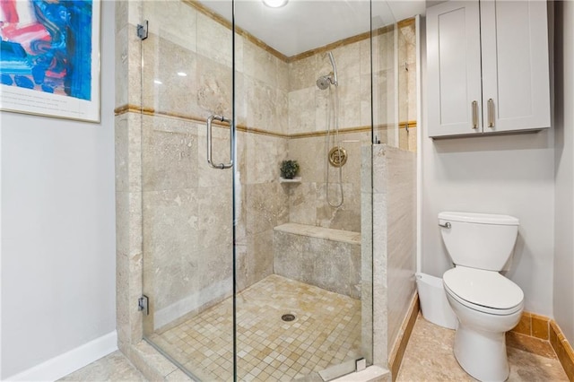 215 Piedmont Ave NE Unit 506, Atlanta, GA 30308 - full bath with a shower stall, baseboards, and toilet