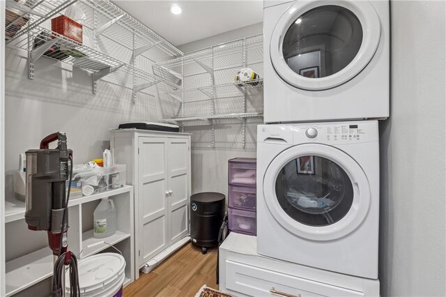 215 Piedmont Ave NE Unit 506, Atlanta, GA 30308 - laundry area featuring laundry area, recessed lighting, stacked washing maching and dryer, and light wood-type flooring