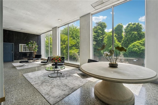 215 Piedmont Ave NE Unit 506, Atlanta, GA 30308 - sunroom featuring floor to ceiling windows and speckled floor