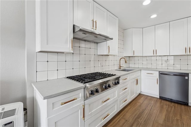 215 Piedmont Ave NE Unit 506, Atlanta, GA 30308 - kitchen with a sink, light countertops, under cabinet range hood, recessed lighting, and stainless steel appliances