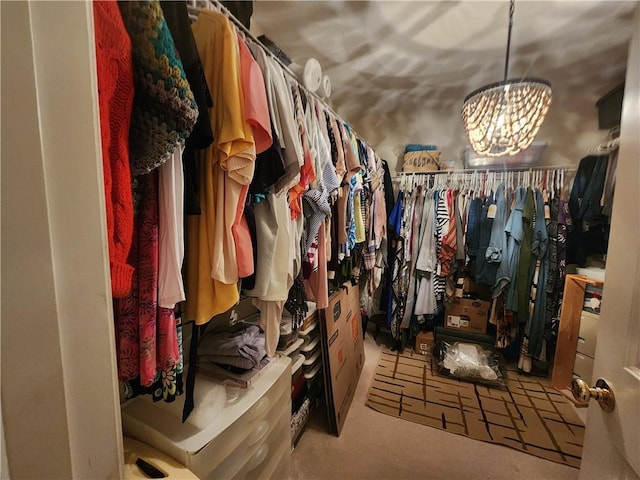 spacious closet featuring carpet floors and a notable chandelier