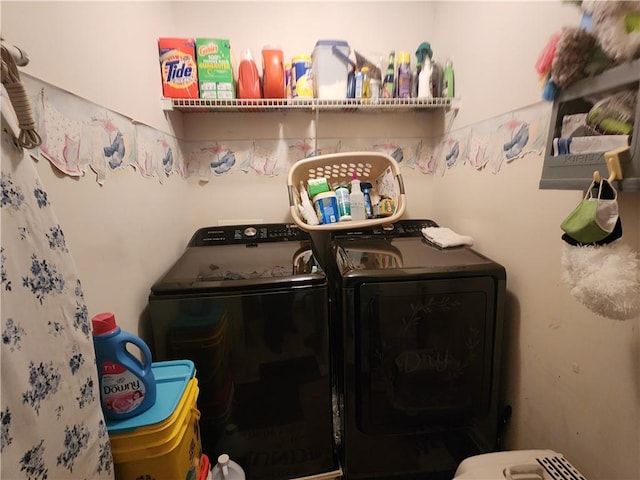 washroom with washer and dryer