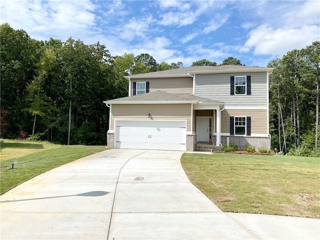 view of front of home featuring a front lawn and a garage