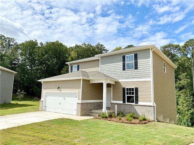 view of front of home with a front yard and a garage