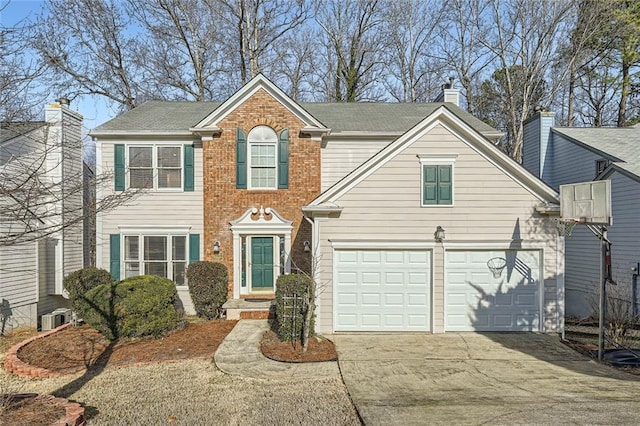 view of front facade featuring a garage and central AC unit