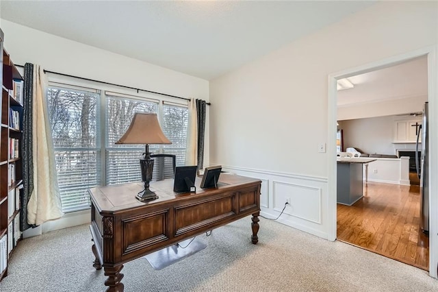 office area featuring light colored carpet